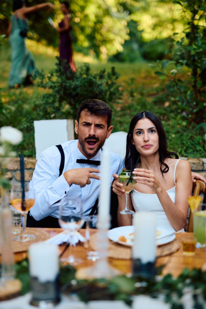 Man and woman with cocktails outdoors
