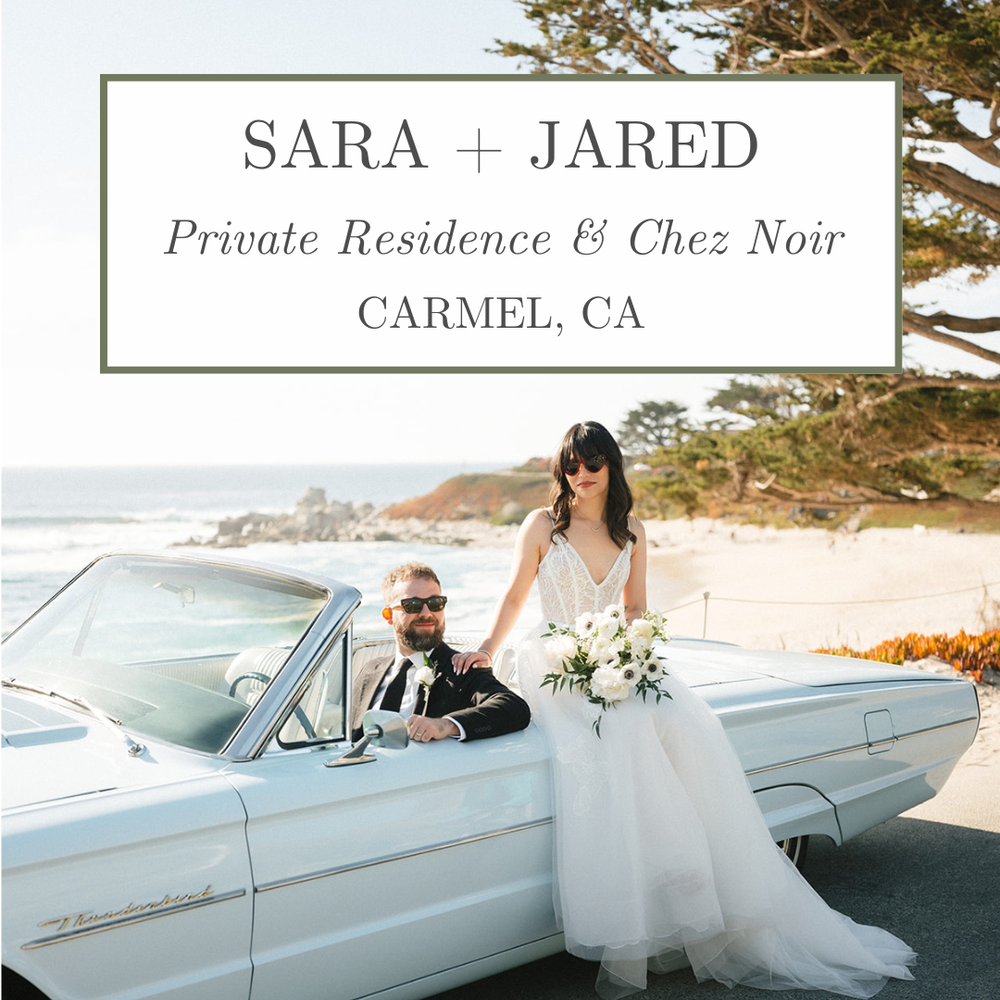 Newlyweds celebrating by vintage convertible